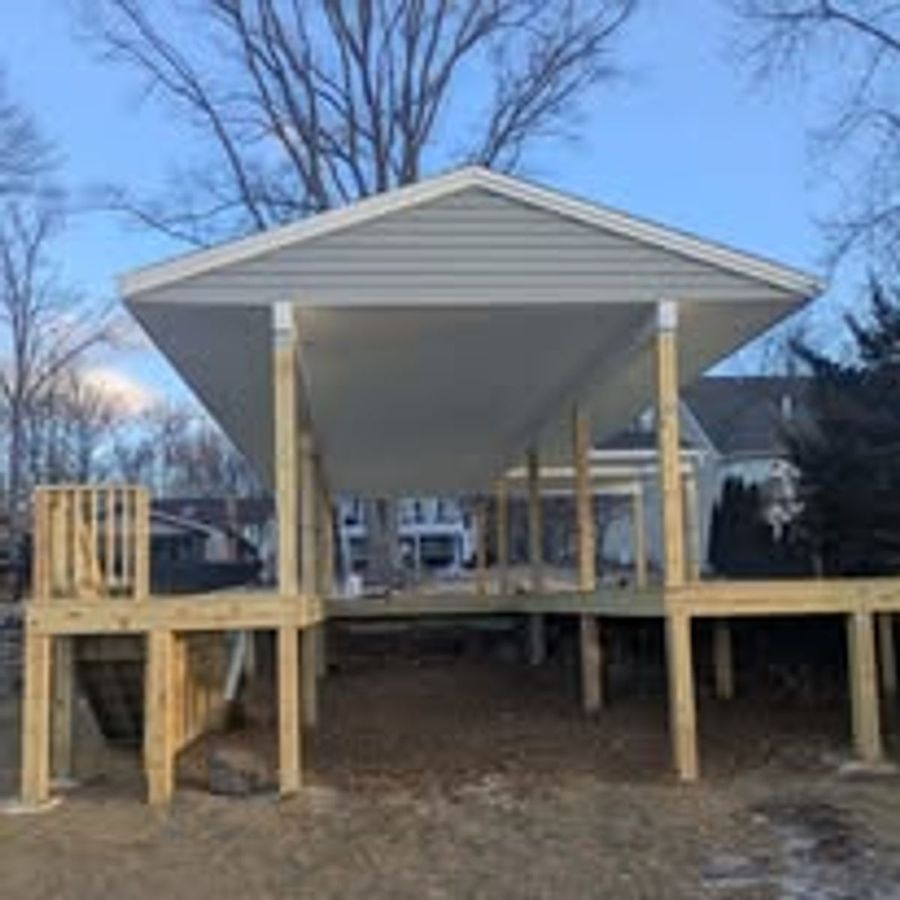 Newly framed covered deck pavilion on posts awaiting its roof